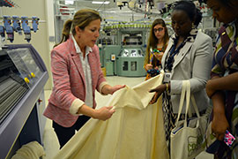 students looking at fabric